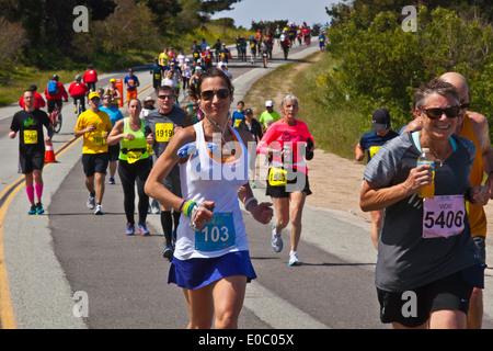 Runners on Highway 1 participate in the 2014 Big Sur Marathon - BIG SUR, CALIFORNIA Stock Photo