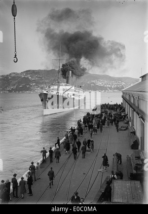 A photograph of the ship Tahiti docked at Wellington Harbour in 1928 or 1929, showcasing the ocean liner's design and the bustling port. Stock Photo