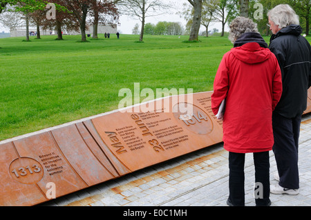 A mature man and woman read the Battle of Bannockburn memorial timeline at the battle field in Stirlingshire, Scotland. Stock Photo