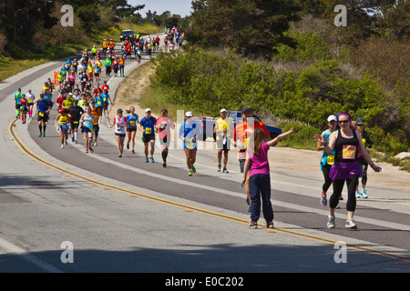 Runners on Highway 1 participate in the 2014 Big Sur Marathon - BIG SUR, CALIFORNIA Stock Photo