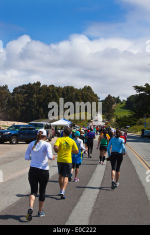 Runners on Highway 1 participate in the 2014 Big Sur Marathon - BIG SUR, CALIFORNIA Stock Photo