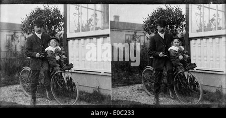 Child and bicycle and 1900's hi-res stock photography and