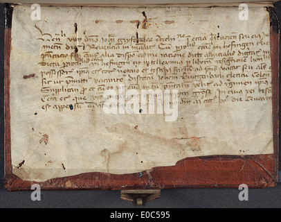 Vellum manuscript fragment used as a pastedown in the binding process Stock Photo