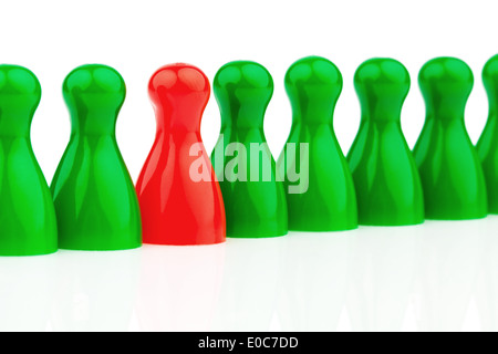 Red and green play figures. Differently in the team. Women's rate in the job., Rote und gruene Spielfiguren. Anders im Team. Fra Stock Photo