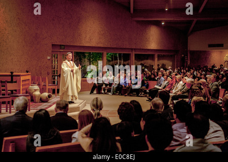A pastor preaches a sermon to his congregation while conducting mass at St. Timothy's Catholic Church, Laguna Niguel, CA. Stock Photo