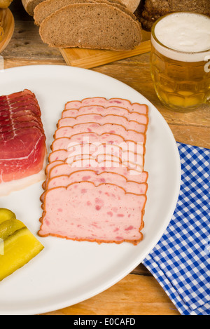 Cold meat, pickles, whole wheat bread and beer, a traditional German cold meal Stock Photo