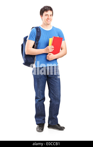 Full length portrait of a male student holding notebooks Stock Photo