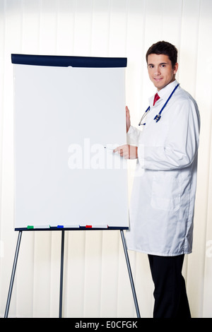 Successful doctor with flipchart by a presentation in meeting Stock Photo