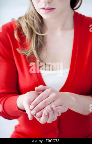 Woman with painful hand Stock Photo