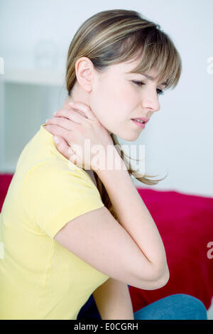 Cervicalgia in a woman Stock Photo