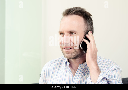 Man having a pleasant conversation on the mobile Stock Photo