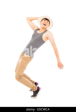 young man imitate dancing pose and holding a hat Stock Photo