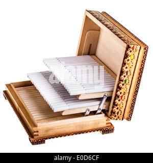 Cigarettes in old wooden box isolated over a white background Stock Photo