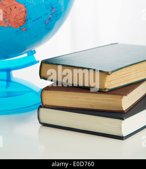 Globe and stack of books Stock Photo
