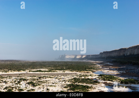 Minnis Bay, Kent, England, UK. A fine mist wraps around the Chalk cliffs at Minnis bay on a bright February morning. Stock Photo