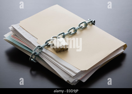 Folder with files closed with chain and padlock Stock Photo