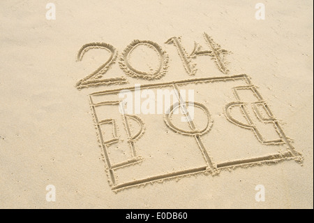Simple line drawing of 2014 football soccer pitch in sand on Brazilian beach Stock Photo