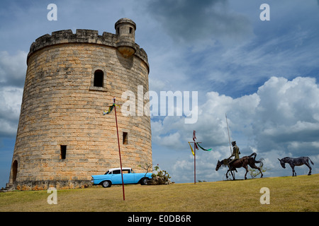 Don Quixote steel sculpture at a stone castle watchtower hiding a water tower in Varadero Cuba Stock Photo