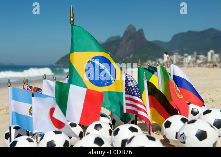 International football country flags with soccer balls on Ipanema beach in Rio de Janeiro Brazil Stock Photo