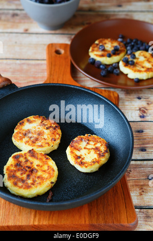 pancakes in a frying pan and on the plate, food closeup Stock Photo