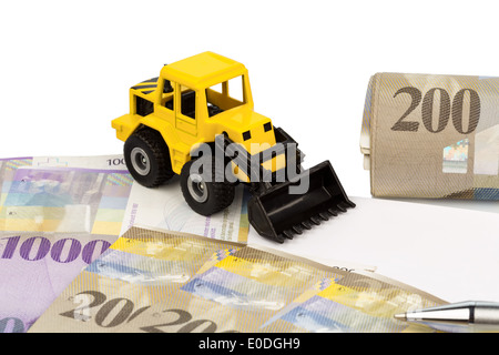 A bill of sale for new excavator. Invest in new vehicles brings cost advantages. With Swiss Franconia, Ein Kaufvertrag fuer neue Stock Photo