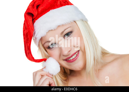A young woman with the cap of a Santa Claus. Christmas woman at Christmas before white background., Eine junge Frau mit der Muet Stock Photo