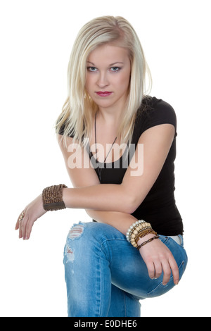 Portrait of a young woman with long blond hair in the studio., Portraet einer jungen Frau mit langen blonden Haaren im Studio. Stock Photo