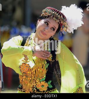 Tashkent, Uzbekistan. 10th May, 2014. A girl shows Tajik Nang (a kind ...