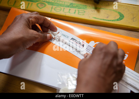 A nurse measures an IUD at a family planning clinic in Dar es Salaam, Tanzania, East Africa. Stock Photo