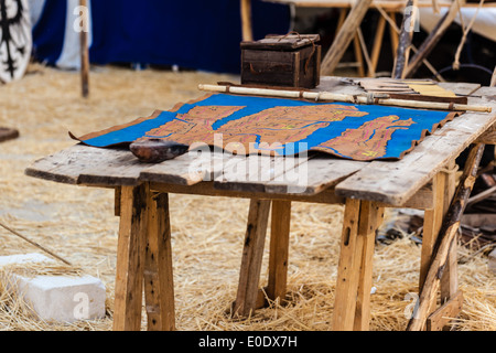 an ancient geographical military map on a wooden table Stock Photo