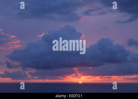 Sun setting in to Pacific Ocean on the Kohala Coast of the Big Island of Hawaii. Stock Photo