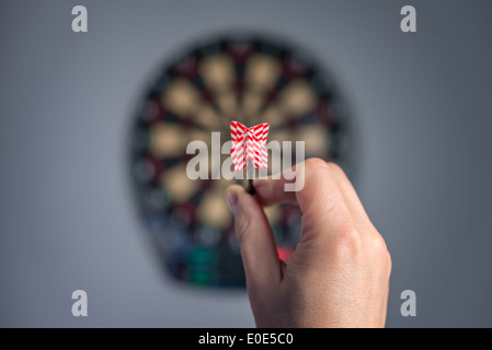 human hand with dart closeup Stock Photo