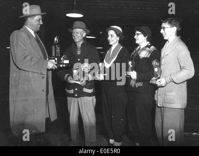 06. Who are these people at the Shirt Sleeve Bonspiel trophy presentation? Stock Photo