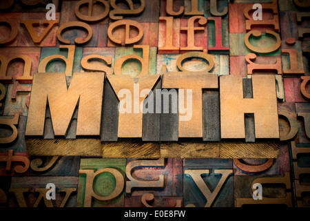 myth word in wood type against background of letterpress printing blocks Stock Photo