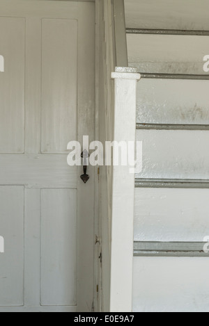 Door and stair detail in old rural home. Stock Photo