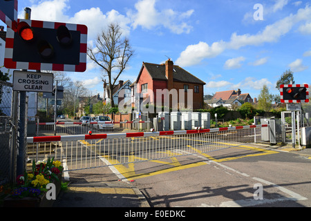 Flashing lights on railway crossing barrier, Queen's Road, Datchet, Berkshire, England, United Kingdom Stock Photo