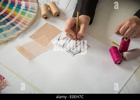 fashion designers, working in progress on tailor table Stock Photo