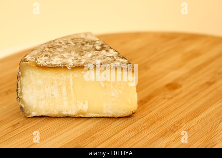 Tomme de savoie cheese on wooden board Stock Photo