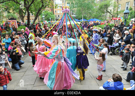 Covent Garden, London, UK. 11 May 2014. The Maypole dancers at the May Fayre in Covent Garden. Credit:  Matthew Chattle/Alamy Live News Stock Photo