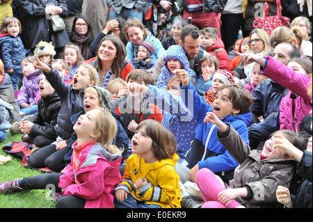 Covent Garden, London, UK. 11 May 2014. The crowd of children gets carried away as they watch one of the many Punch & Judy shows at the May Fayre in Covent Garden. Credit:  Matthew Chattle/Alamy Live News Stock Photo