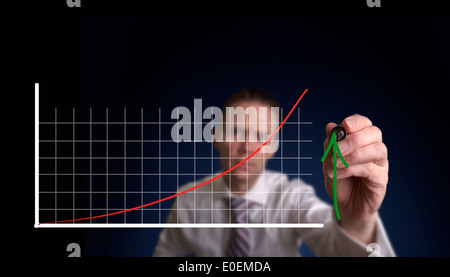 Businessman hand drawing a virtual chart on a clear screen. Stock Photo