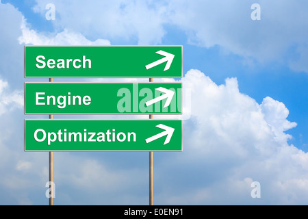 SEO or search engine optimization on green road sign with blue sky Stock Photo