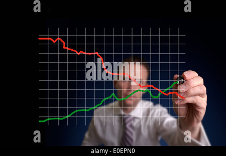 Businessman hand drawing a virtual chart on a clear screen. Stock Photo