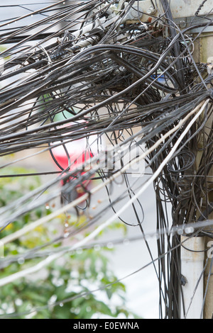 A tangle of cables and wires in Saigon, Vietnam Stock Photo