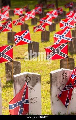 Confederate rebel flags decorate grave markers of soldiers killed in the US Civil War during Confederate Memorial Day at Magnolia Cemetery April 10, 2014 in Charleston, SC. Confederate Memorial Day honors the approximately 258,000 Confederate soldiers that died in the American Civil War. Stock Photo