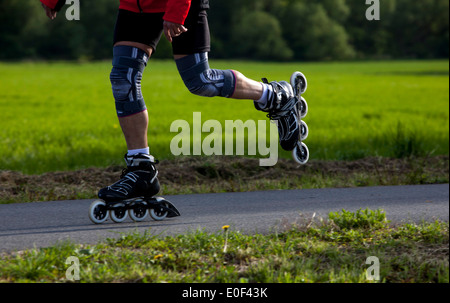 Inline skating on path Stock Photo