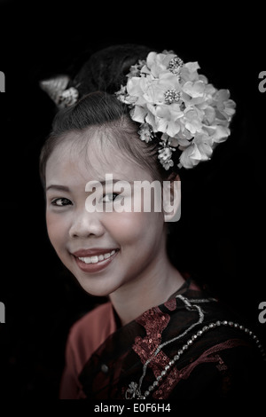Thailand girl portrait with flowers in her hair. Thailand Southeast  Asia. Asian woman smiling Stock Photo