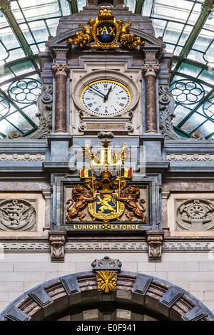 The clock above the entrance hall of the Antwerpen-Centraal railway station. Stock Photo