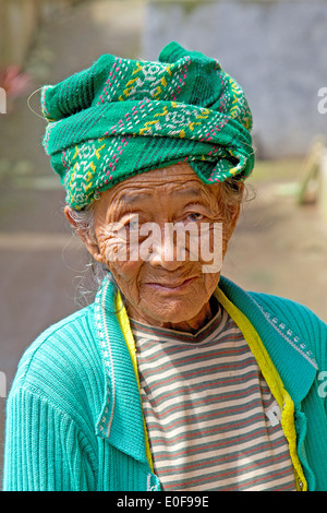 BALI - JUNE 24, 2010: This elderly Balinese woman lives with her family in a small village in the Central Highlands of Bali. Stock Photo