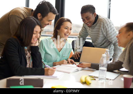 Group of young multiracial people working in modern office. Businessmen ...